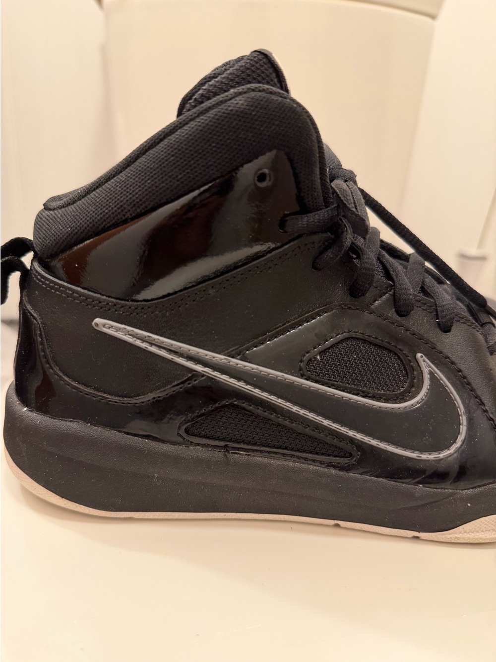 black Nike trainers